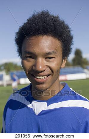A portrait of a soccer player smiling View Large Photo Image Stock Photograph - A portrait of a soccer player smiling. Fotosearch
