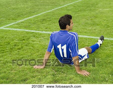 A soccer player resting on the sidelines View Large Photo Image Stock Photo - A soccer player resting on the sidelines. Fotosearch