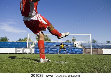 A soccer player taking a penalty shot View Large Photo Image Stock Photo - A soccer player taking a penalty shot. Fotosearch