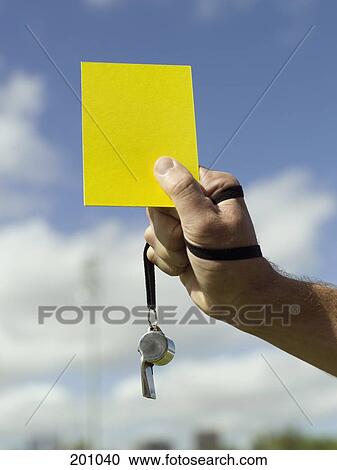 A soccer referee holding a yellow card View Large Photo Image Stock Image - A soccer referee holding a yellow card. Fotosearch