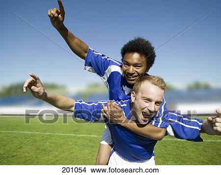 Two soccer players celebrating View Large Photo Image Picture - Two soccer players celebrating. Fotosearch
