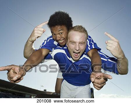 Two soccer players celebrating View Large Photo Image Stock Photo - Two soccer players celebrating. Fotosearch