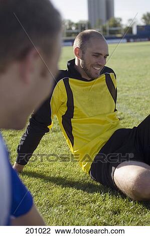 Stock Image - Two soccer players talking. Fotosearch
