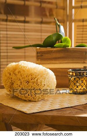 Bath sponge and candle on table View Large Photo Image Stock Image - Bath sponge and candle on table. Fotosearch