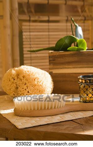 Bath sponge, brush and candle on table View Large Photo Image Stock Image - Bath sponge, brush and candle on table. Fotosearch