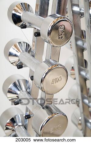 Silver dumbbells on rack View Large Photo Image Stock Photography - Silver dumbbells on rack. Fotosearch
