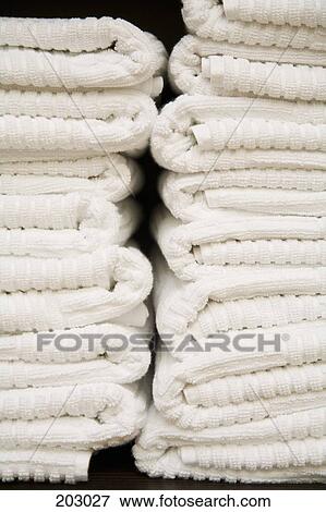 Stack of folded white towels View Large Photo Image Stock Photo - Stack of folded white towels. Fotosearch