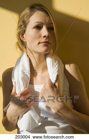 Young woman with towel around her neck View Large Photo Image Picture - Young woman with towel around her neck. Fotosearch