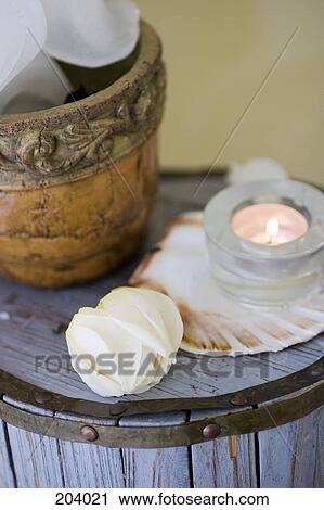 Side table with candle and flower pot View Large Photo Image Stock Image - Side table with candle and flower pot. Fotosearch