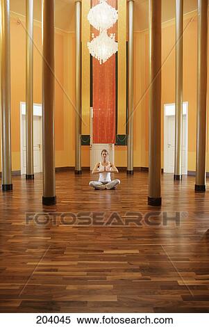 Young woman meditating View Large Photo Image Stock Photography - Young woman meditating. Fotosearch