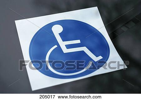 Disabled sticker on dashboard of car View Large Photo Image Stock Photo - Disabled sticker on dashboard of car. Fotosearch