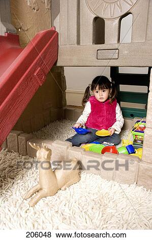 A little girl playing with toys View Large Photo Image Stock Photo - A little girl playing with toys. Fotosearch