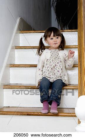 A little girl sitting on stairs View Large Photo Image Stock Image - A little girl sitting on stairs. Fotosearch