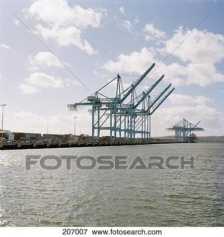 Heavy cranes on commercial dock View Large Photo Image Stock Photo - Heavy cranes on commercial dock. Fotosearch