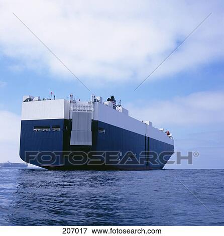 Rear view of cargo ship sailing at sea View Large Photo Image Stock Photo - Rear view of cargo ship sailing at sea. Fotosearch