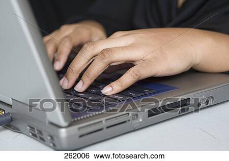 Woman using laptop View Large Photo Image Stock Photograph - Woman using laptop. Fotosearch
