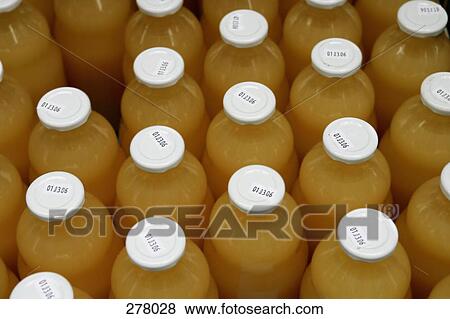 Stock Photo - Bottles of fruit juice. Fotosearch