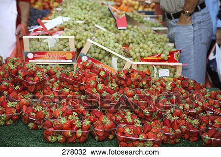 Strawberries and grapes at market stall View Large Photo Image Stock Image - Strawberries and grapes at market stall. Fotosearch