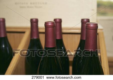 Group of wine bottles on shelf View Large Photo Image Stock Image - Group of wine bottles on shelf. Fotosearch