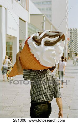 Man carrying large plastic ice cream View Large Photo Image Stock Photograph - Man carrying large plastic ice cream. Fotosearch
