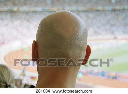 Rear view of man watching soccer game View Large Photo Image Picture - Rear view of man watching soccer game. Fotosearch