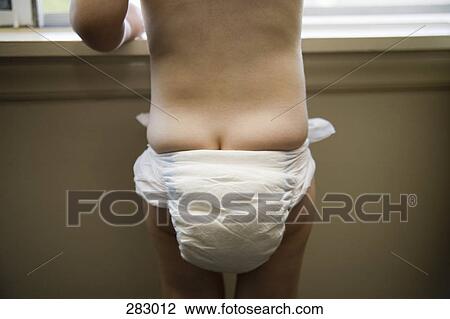 Toddler wearing diaper and looking out window View Large Photo Image Stock Image - Toddler wearing diaper and looking out window. Fotosearch