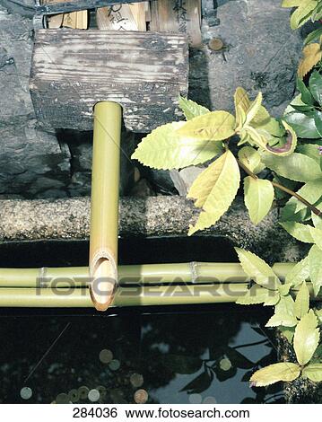 Bamboo water pipe in Japanese garden View Large Photo Image Stock Photograph - Bamboo water pipe in Japanese garden. Fotosearch