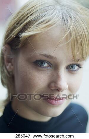 Close-up of young woman’s face View Large Photo Image Stock Photo - Close-up of young woman’s face. Fotosearch