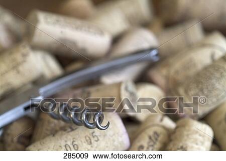 Corkscrew on pile of corks View Large Photo Image Stock Photo - Corkscrew on pile of corks. Fotosearch