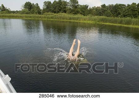 Man diving into water View Large Photo Image Stock Photograph - Man diving into water. Fotosearch