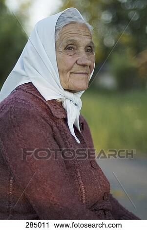 Portrait of senior woman wearing headscarf View Large Photo Image Stock Image - Portrait of senior woman wearing headscarf. Fotosearch