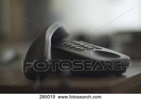 Stock Photo - Telephone with receiver of hook. Fotosearch