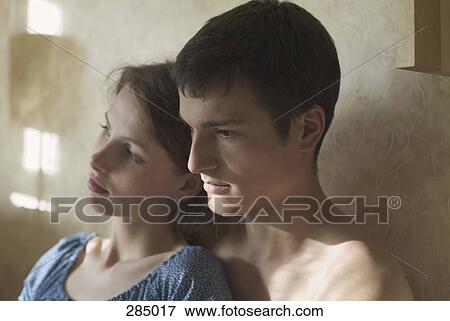 Stock Photo - Young couple sitting together. Fotosearch