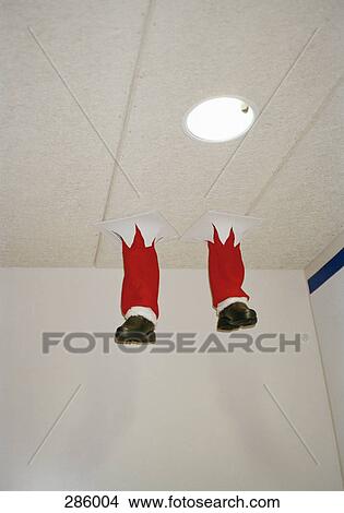 Santa Claus falling through the ceiling View Large Photo Image Picture - Santa Claus falling through the ceiling. Fotosearch