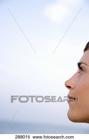 Profile of woman on beach View Large Photo Image Stock Photography - Profile of woman on beach. Fotosearch