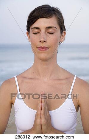 Woman on beach in lotus position View Large Photo Image Stock Image - Woman on beach in lotus position. Fotosearch