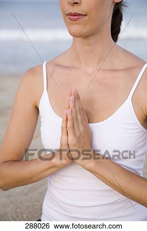 Woman on beach in lotus position View Large Photo Image Stock Photograph - Woman on beach in lotus position. Fotosearch