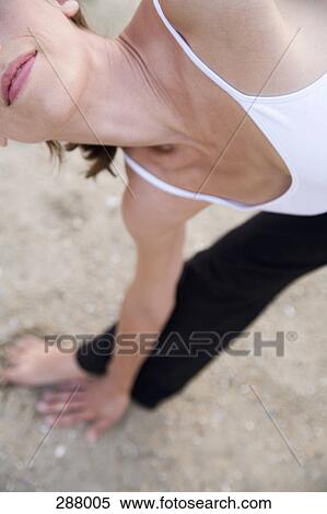 Woman practicing yoga on beach View Large Photo Image Stock Photography - Woman practicing yoga on beach. Fotosearch