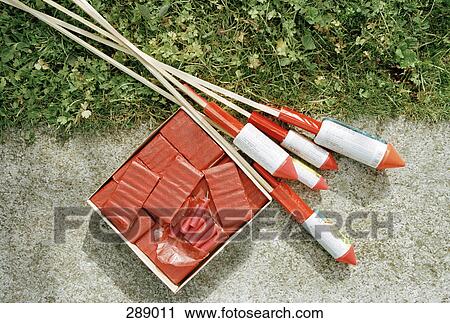 Bottle rockets and fireworks on ground View Large Photo Image Stock Image - Bottle rockets and fireworks on ground. Fotosearch