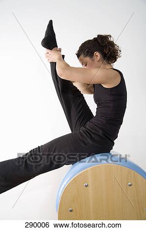Stock Photograph - Woman exercising on pommel horse. Fotosearch