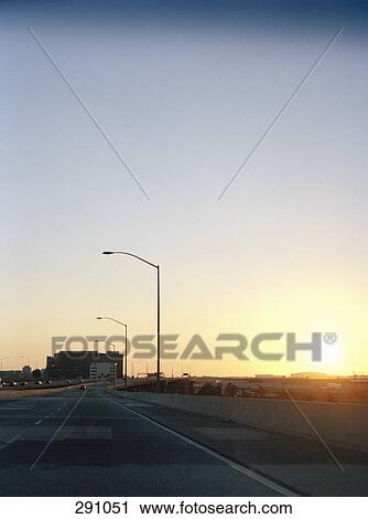 Highway at sunset View Large Photo Image Stock Image - Highway at sunset. Fotosearch