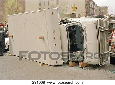 Truck lying on side in city street View Large Photo Image Stock Photo - Truck lying on side in city street. Fotosearch