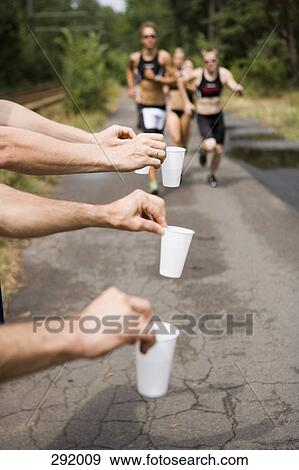 Refreshments for athletes running in sports race View Large Photo Image Stock Photo - Refreshments for athletes running in sports race. Fotosearch