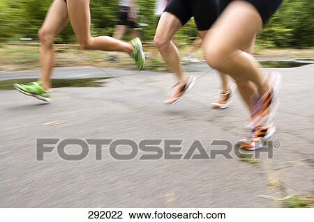 Three men running on road View Large Photo Image Stock Image - Three men running on road. Fotosearch