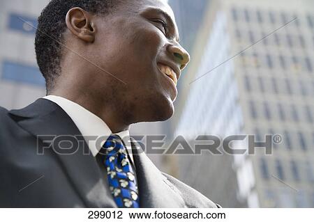 Businessman smiling View Large Photo Image Stock Image - Businessman smiling. Fotosearch