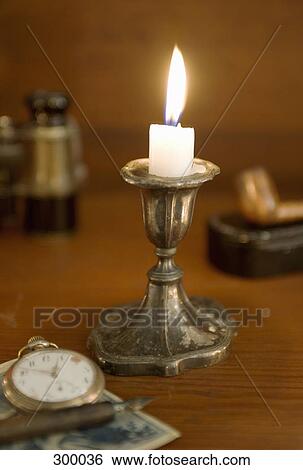 Collection of old-fashioned objects, focus on candle View Large Photo Image Stock Photograph - Collection of old-fashioned objects, focus on candle. Fotosearch