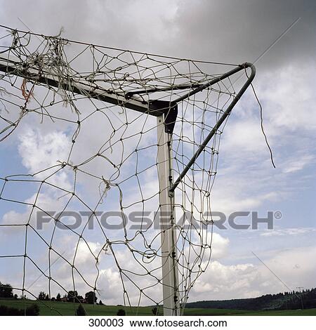 Corner of goal post and broken net View Large Photo Image Stock Image - Corner of goal post and broken net. Fotosearch
