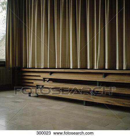 Stock Image - Curtains across stage. Fotosearch