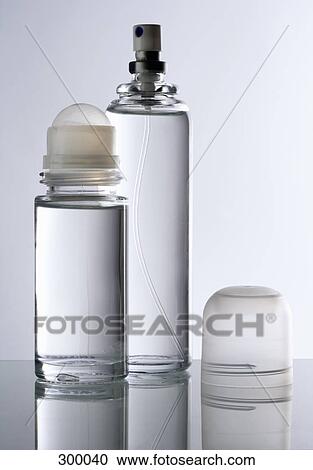 Stock Image - Glass deodorant and perfume bottle. Fotosearch