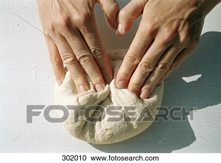 Close-up of hands kneading dough View Large Photo Image Stock Image - Close-up of hands kneading dough. Fotosearch